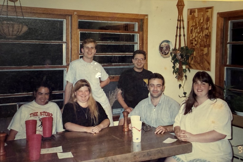 Six people around the dining table.